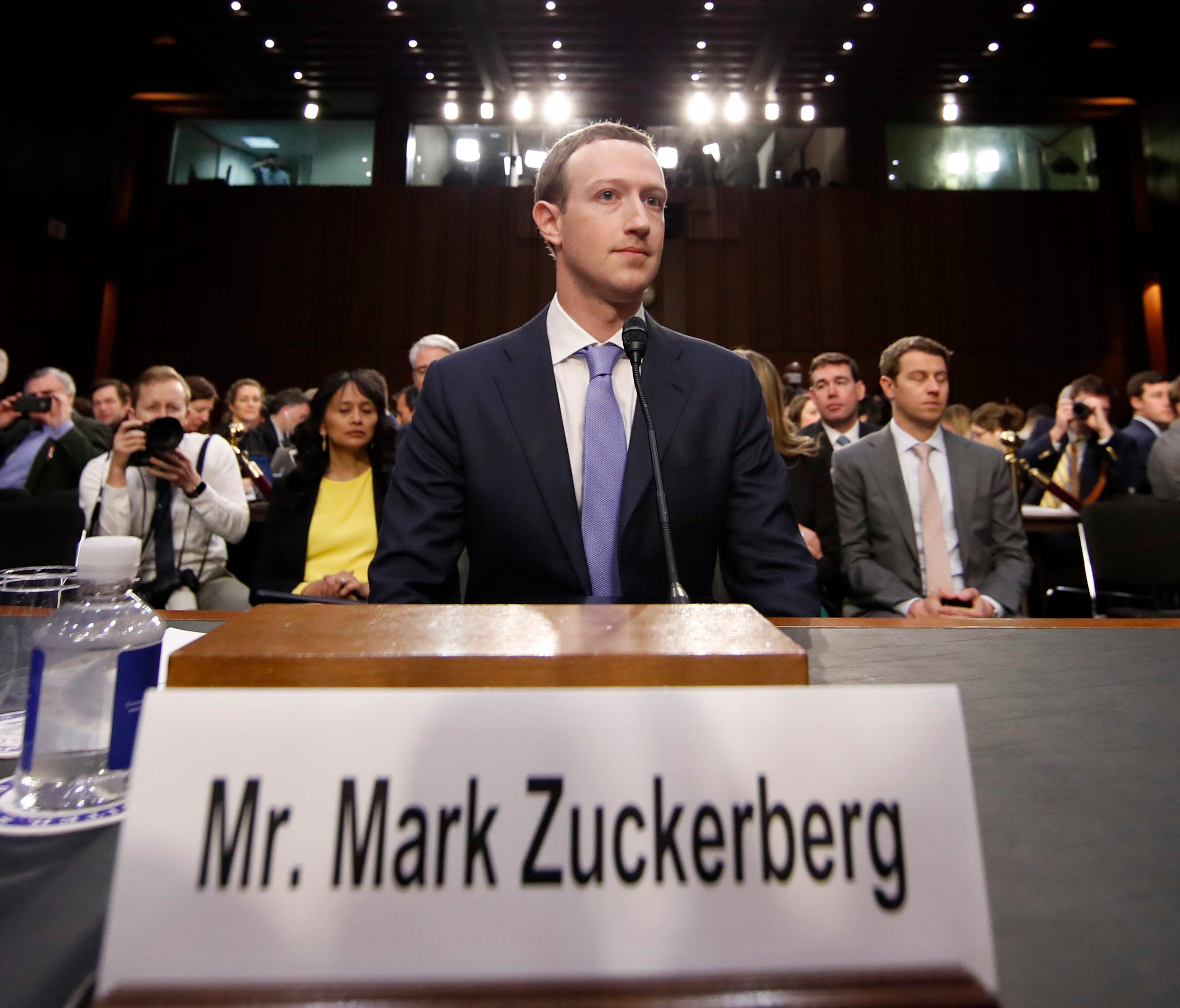 Facebook CEO Mark Zuckerberg takes his seat after a break to continue to testify before a joint hearing of the Commerce and Judiciary Committees on Capitol Hill in Washington, Tuesday, April 10, 2018, about the use of Facebook data to target American