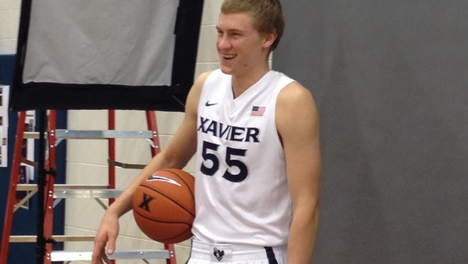 JP Macura couldn't help but laugh during the Musketeers' Sunday picture session.