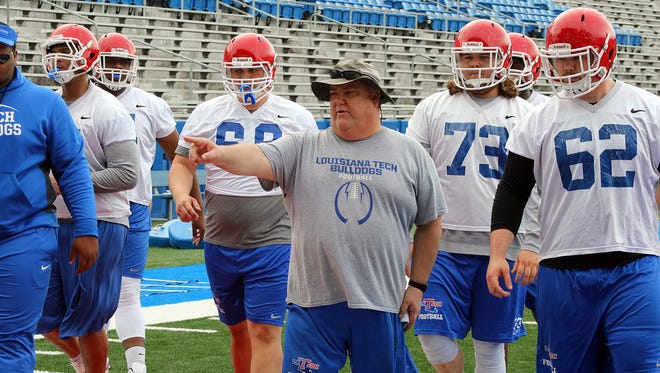 Louisiana Tech offensive line coach Robert McFarland goes through drills with his group earlier this spring. Bulldogs coach Skip Holtz said Wednesday he wants to see more consistency with his offense.