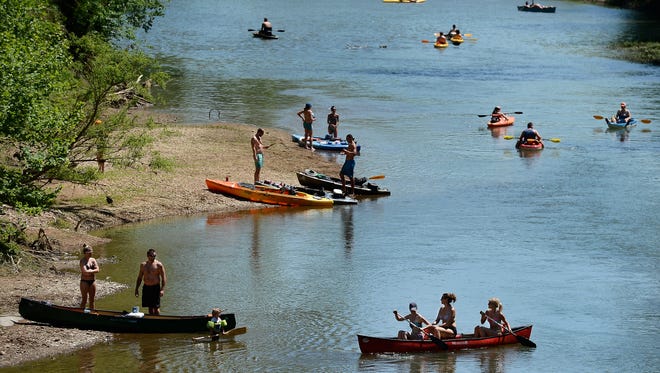 People enjoy kayaking and canoeing on the Narrows of the Harpeth River at the Harpeth State Park Saturday May 7, 2016, in Kingston Springs, Tenn. 