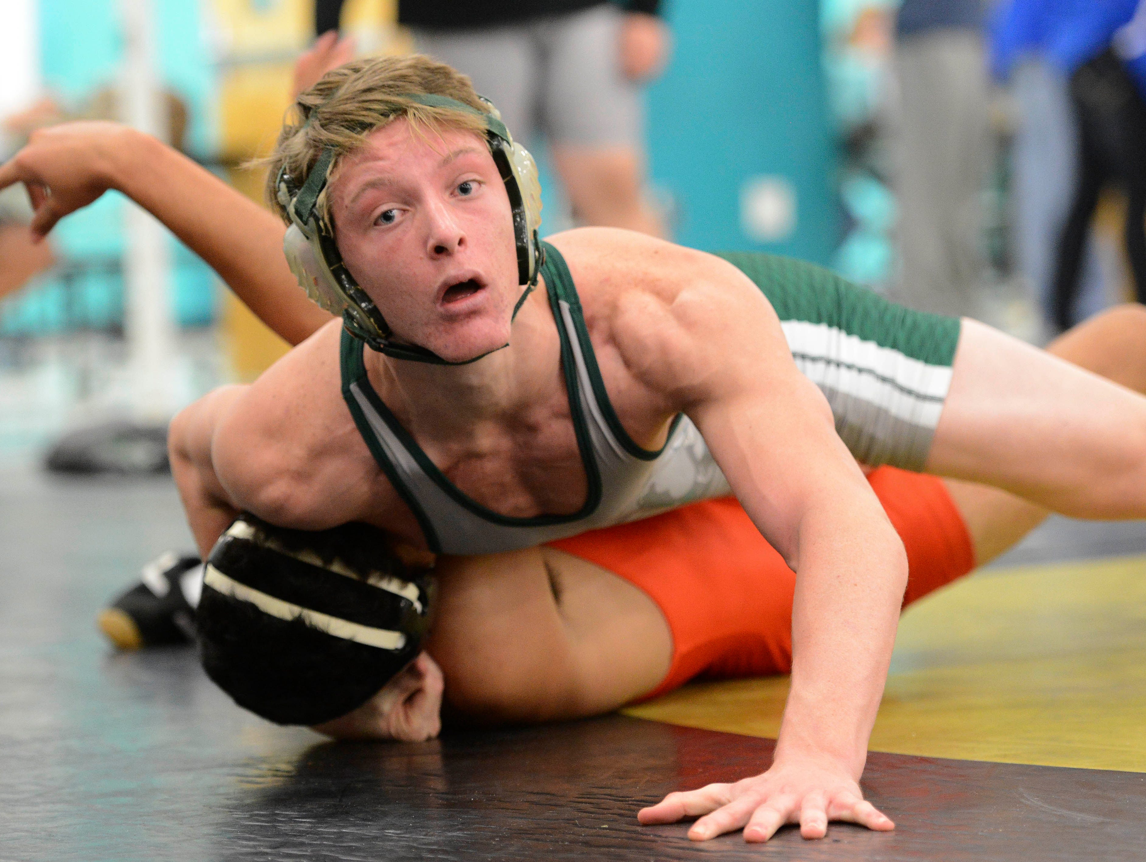Chase Carl of Melbourne wrestles John Wright of Boone on Day 1 of the Barbara Pill Memorial Wrestling Tournament.