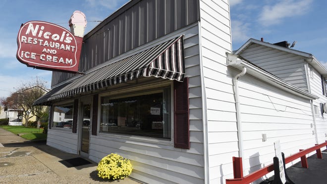 Nearly 500 items from the former Nicol's Family Style Restaurant were sold at auction. The iconic Nicol's Restaurant and Ice Cream storefront sign was the highest bid at $16,025.