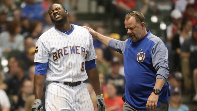 Brewers centerfielder Lorenzo Cain reacts after being hit by a pitch during the fourth inning on Saturday night at Miller Park.