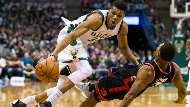Milwaukee Bucks forward Giannis Antetokounmpo (34) runs into Toronto Raptors guard Kyle Lowry (7) during the third quarter in game four of the first round of the 2017 NBA Playoffs at BMO Harris Bradley Center.