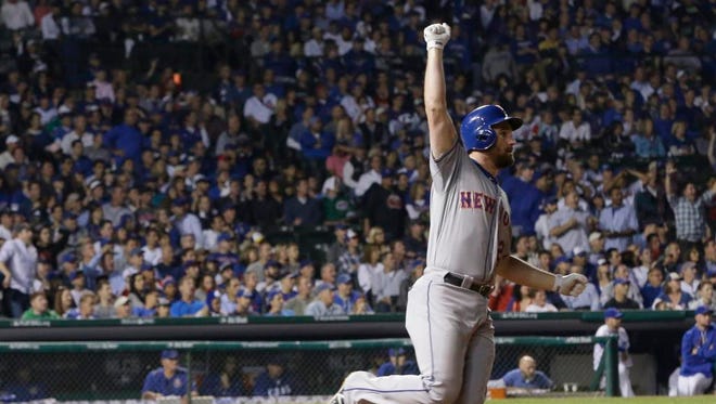 New York Mets' Daniel Murphy rounds first after hitting a home run during the eighth inning of Game 4 of the National League baseball championship series against the Chicago Cubs Wednesday in Chicago.
