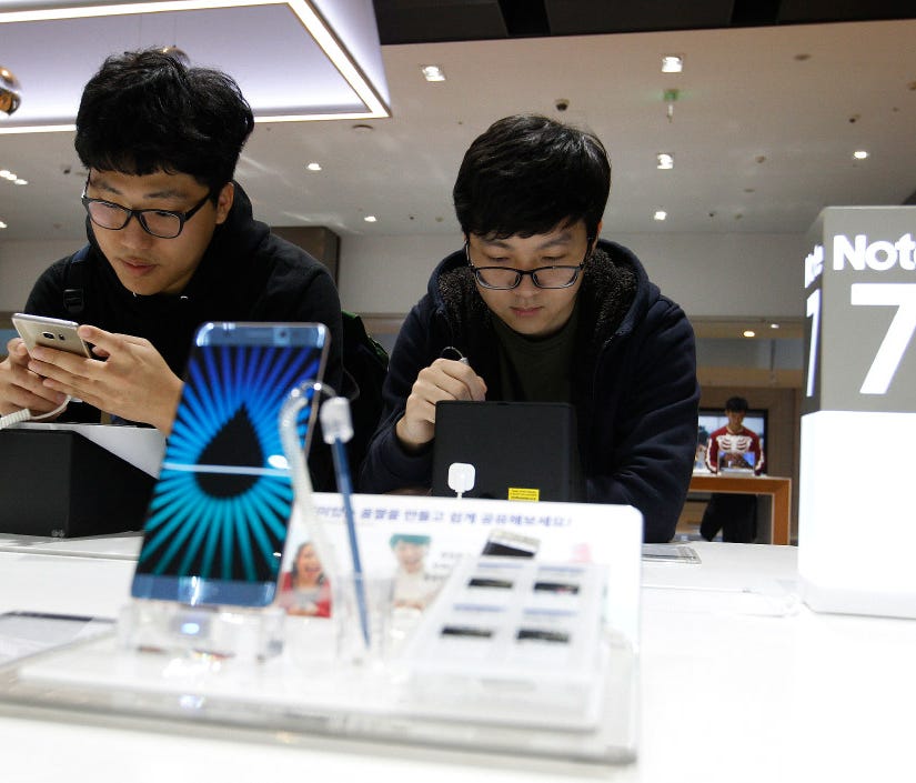 In this Monday, Oct. 10, 2016, file photo, South Korean high school students try out Samsung Electronics Galaxy Note 7 smartphones at the company's shop in Seoul, South Korea. At an event in NYC Wednesday, Samsung is expected to launch its newest Not