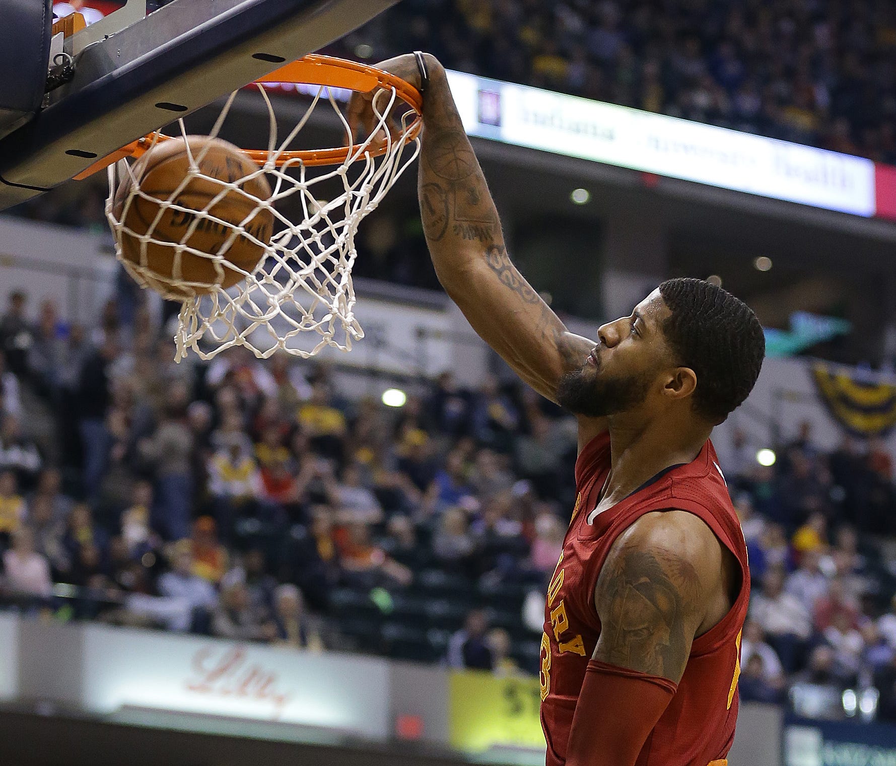 Indiana Pacers forward Paul George (13) slams down two points in the first half of their game Wednesday, April 6, 2016, evening at Bankers Life Fieldhouse.