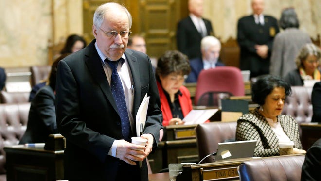 House Speaker Frank Chopp, D-Seattle, walks on the House floor, Monday, Jan. 23, 2017, at the Capitol in Olympia, Wash. The House passed a bill Monday that delays a deadline for a reduction in the amount of money school districts can collect through local property tax levies, and it now heads to the Republican-controlled Senate.