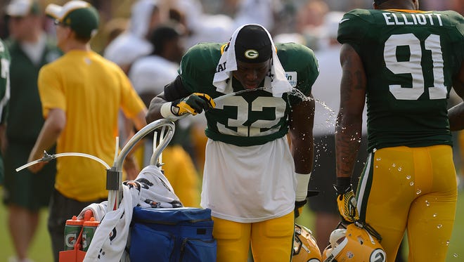 Green Bay Packers safety Chris Banjo (32) takes a water break during training camp practice at Ray Nitschke Field on Friday, Aug. 1, 2014. Evan Siegle/Press-Gazette Media