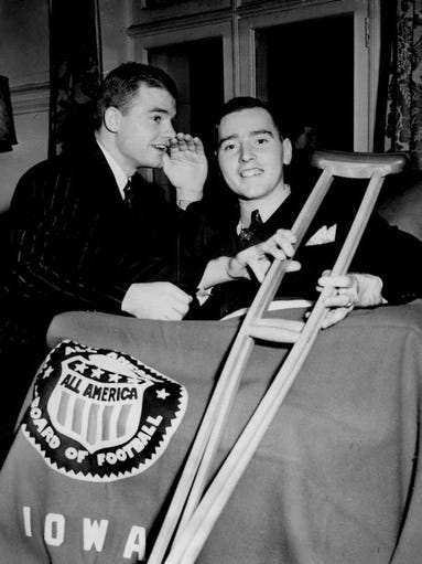 Nile Kinnick whispers encouragement to Edwin 'Rip'