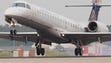 A United Express Embraer E145 regional jet lands at