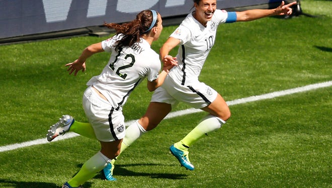 Jul 5, 2015; Vancouver, British Columbia, CAN; United States midfielder Carli Lloyd (10) celebrates with teammates after scoring against Japan during the first half of the final of the FIFA 2015 Women's World Cup at BC Place Stadium. Mandatory Credit: Erich Schlegel-USA TODAY Sports