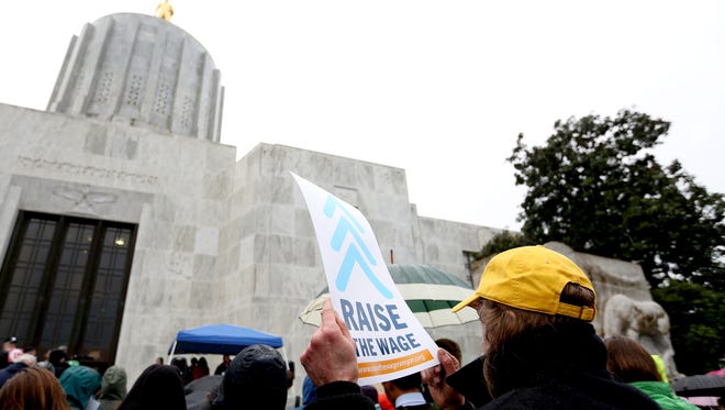 Hundreds attend a rally for increasing the minimum wage at the Oregon State Capitol in Salem on Thursday, Jan. 14, 2016.