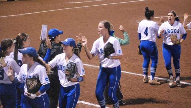 The University of West Florida softball team walks off the field during their Division II NCAA Championships opener against Armstrong State.
