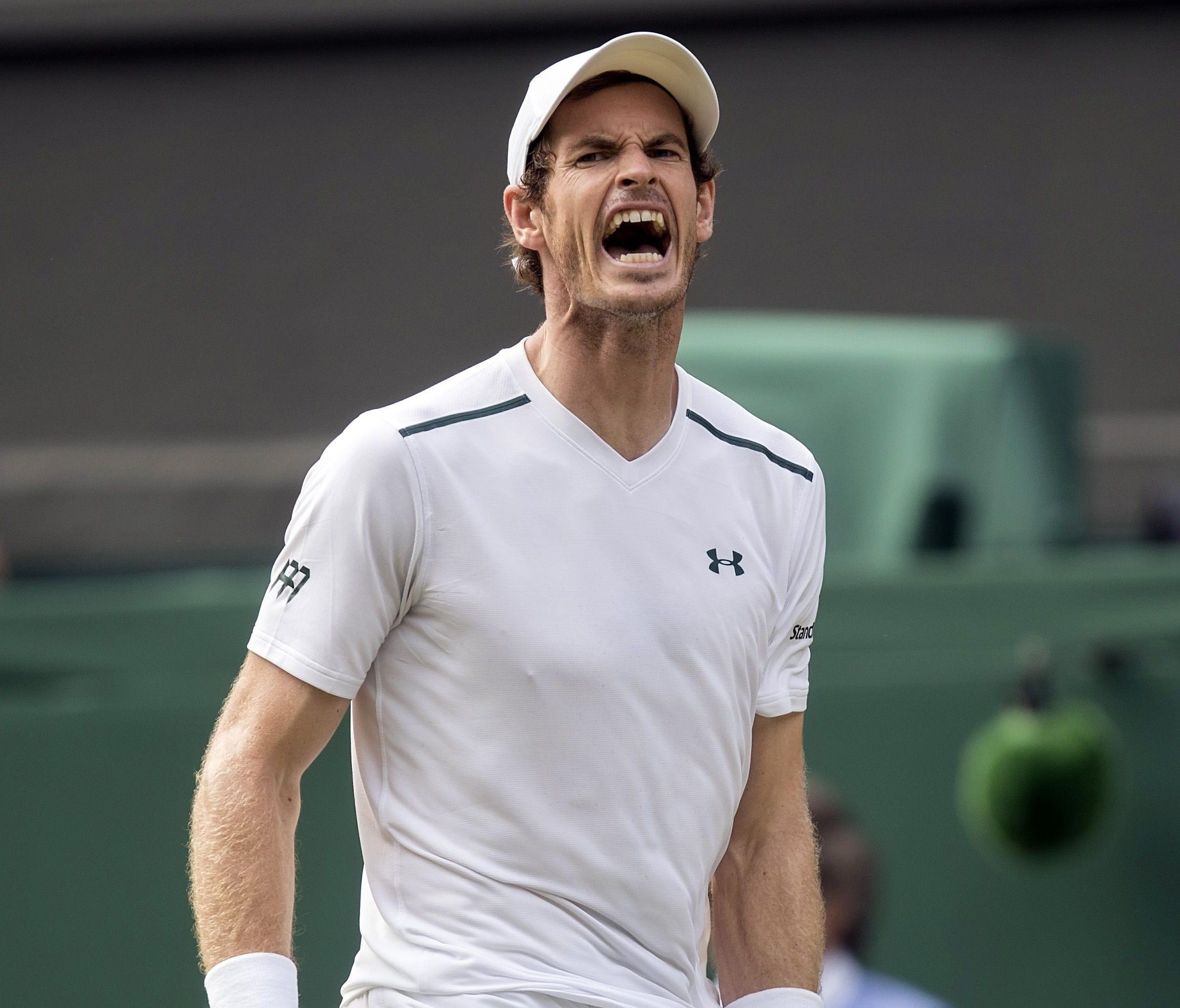 Andy Murray (GBR) reacts during his match against Benoit Paire (FRA) on day seven at the All England Lawn Tennis and Croquet Club.