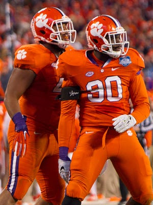Clemson Tigers defensive end Shaq Lawson (90). with with defensive lineman Christian Wilkins.