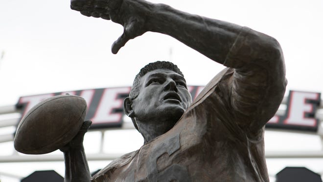 The statue of famed Louisville's famed quarterback, Johnny Unitas, stands tall in its new location along the southern terrace of Papa John's Stadium. Sept. 14, 2017