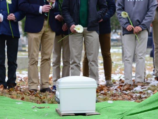 Students from Delbarton School in Morristown hold a