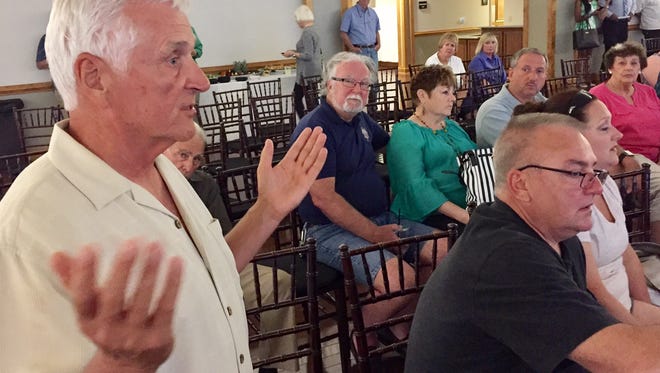 In this Thursday, June 25, 2017 photo, Ocean Pines property owner Gary Sirianni discusses his fear of sinkholes in backyards caused by woodworms at a meeting of the Ocean Pines Association.