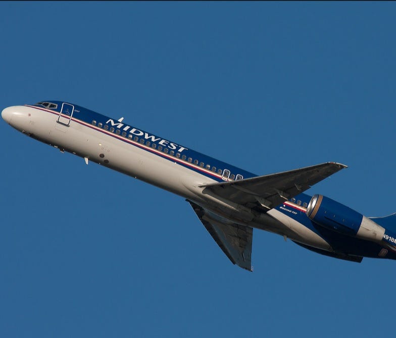 A Midwest Boeing 717 is seen flying on Sept. 10, 2008.