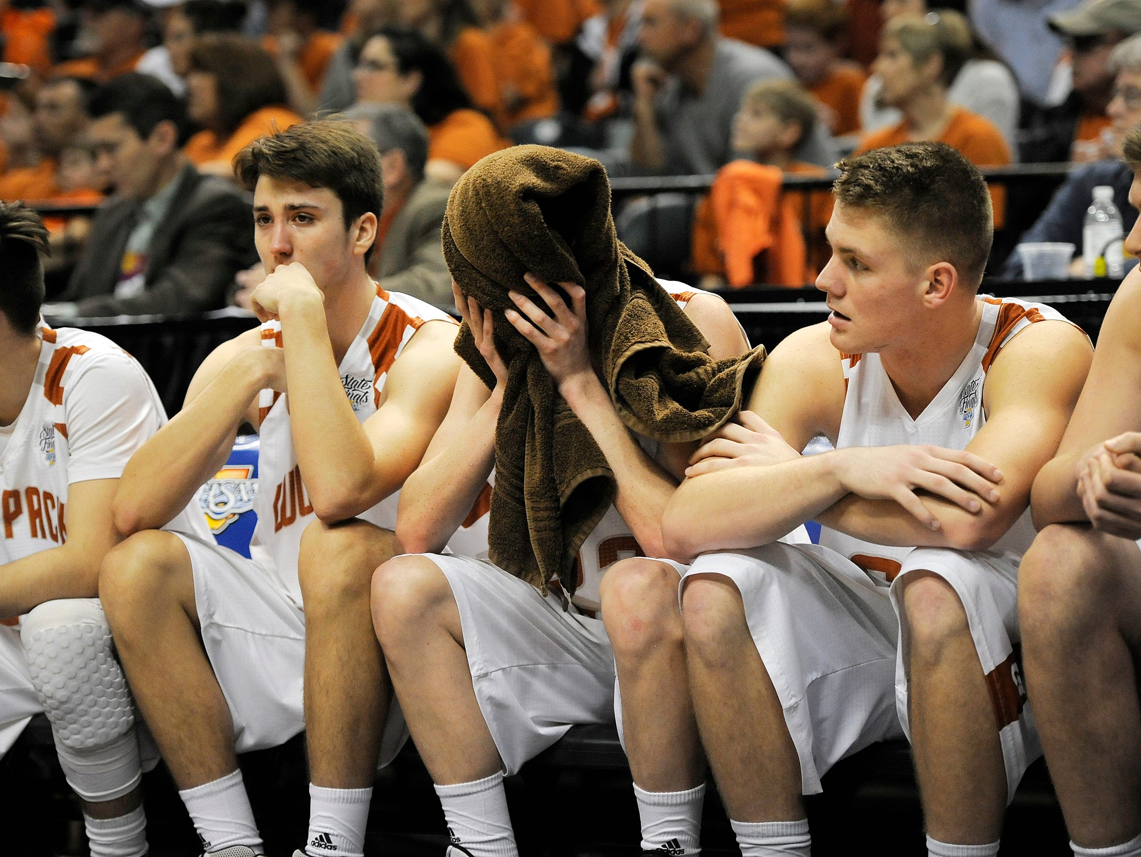 Crawford County sits dejected on the bench as the clock winds down in a loss to Frankton 60-32 on Saturday in the 2017 IHSAA 2A Boys Basketball State Final at Bankers Life Fieldhouse in Indianapolis. Mar. 25, 2017