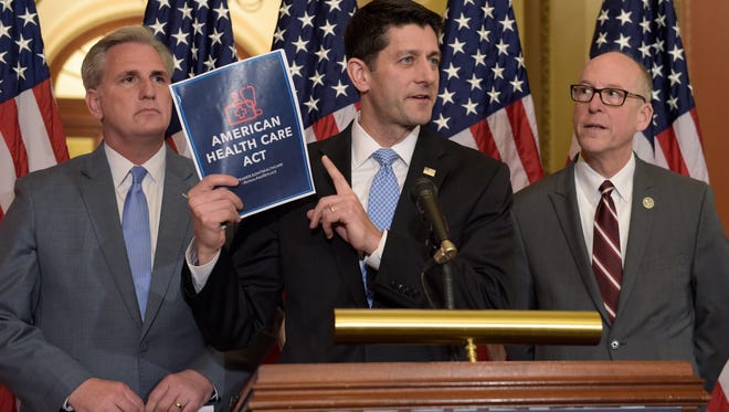 House Speaker Paul Ryan (center) stands with Energy and Commerce Committee Chairman Greg Walden (right) and House Majority Whip Kevin McCarthy during a news conference on the American Health Care Act on March 7, 2017 on Capitol Hill in Washington.