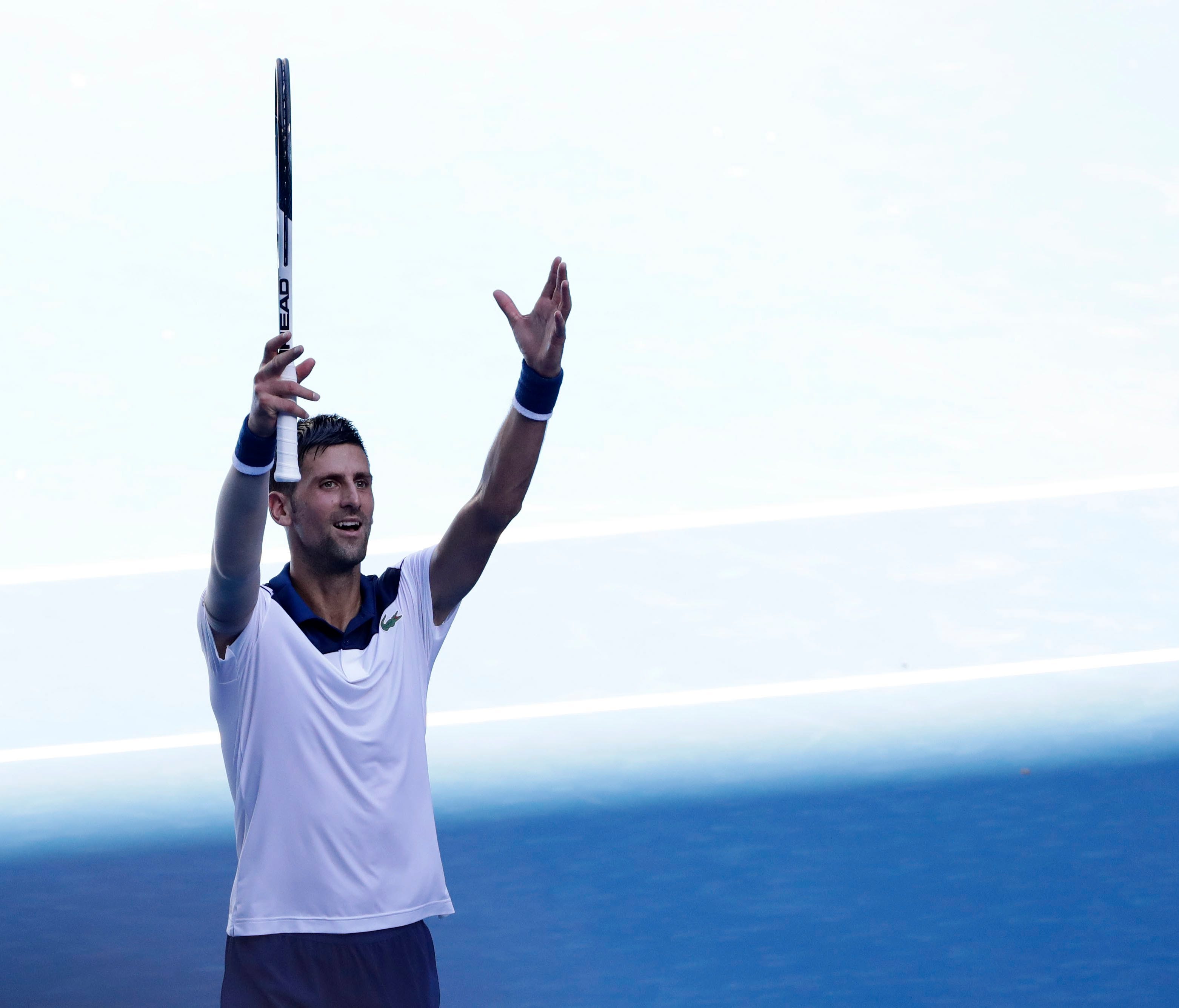 Djokovic celebrates after winning his second round match against Gael Monfils.
