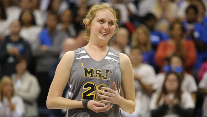 Lauren Hill, 19, a freshman at Mount St. Joseph University, receives the Wilma Rudolph Student Athlete Achievement Award after her first college basketball game.