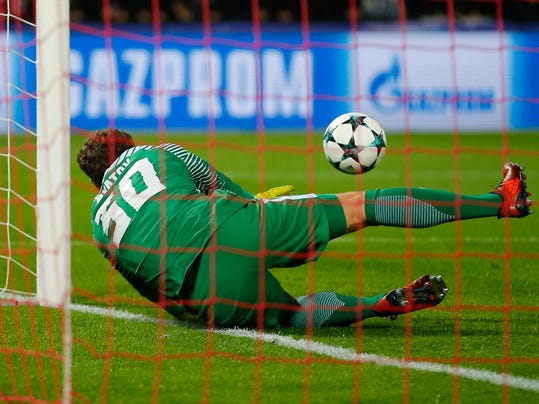 Shakhtar goalkeeper Andriy Pyatov saves on the goal line in the last minutes of a Champions League Group F soccer match between Feyenoord and Shakhtar Donetsk at the Kuip stadium in Rotterdam, Netherlands, Tuesday, Oct. 17, 2017. (AP Photo/Peter Dejong)