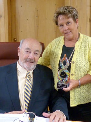 Ruidoso Village Manager Debi Lee celebrates her award as top city manager with Mayor Tom Battin.