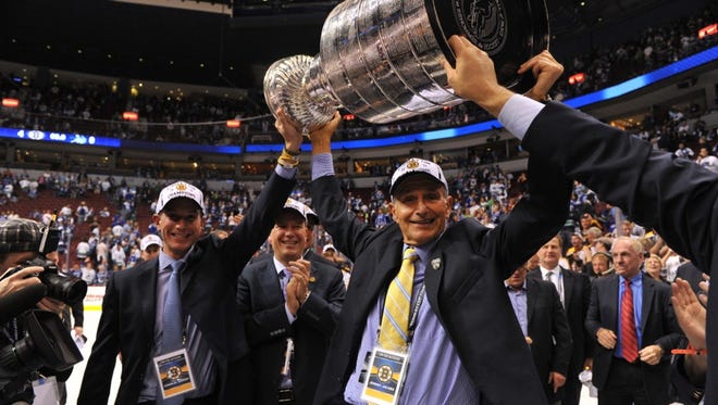 Jeremy Jacobs, the chairman of sports concessionaire Delaware North and owner of the Boston Bruins, hoists the Stanley Cup in 2011 after his Bruins won the championship.