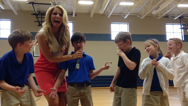 Miss Tennessee Hayley Lewis sang ‘Let It Go’ from the movie ‘Frozen’ after her speech on respect and bullying at the Montessori School at Bemis on Monday.