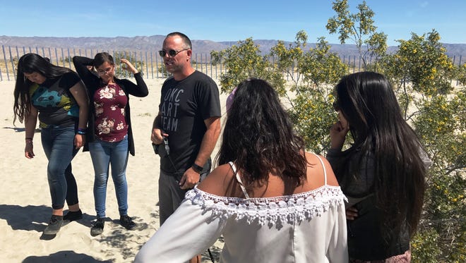 Participating Desert X artist Phillip K. Smith speaks with Palm Springs Unified School District students, who recently toured his and other installations.