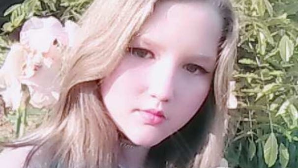 Ryleigh Taylor, 11, poses with the fossil she...