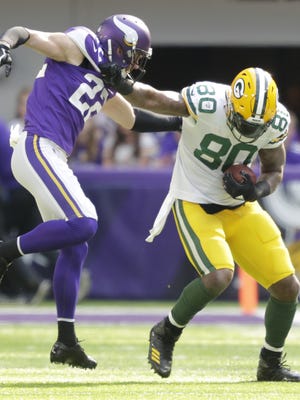 Green Bay Packers tight end Martellus Bennett (80) fends off Minnesota Vikings free safety Harrison Smith (22) on a reception in the first quarter during their football game Sunday, October 15, 2017, at U.S. Bank Stadium in Minneapolis, Minn.