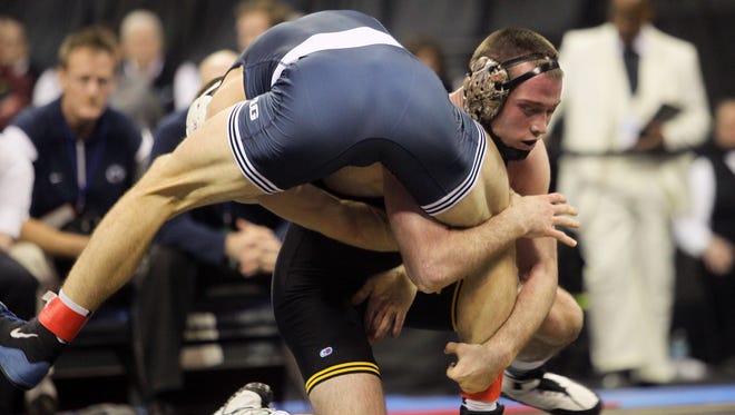 Iowa's Patrick Rhoads wrestles Penn State's Geno Morelli at 165 pounds at the Big Ten Championships at Carver-Hawkeye Arena on Sunday, March 6, 2016. Rhoads beat Morelli in sudden victory to take seventh place.