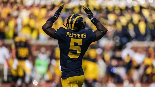 Michigan Wolverines linebacker Jabrill Peppers celebrates after making a tackle against Hawaii during the opener at Michigan Stadium in Ann Arbor, Michigan, on Saturday, September 3, 2016.