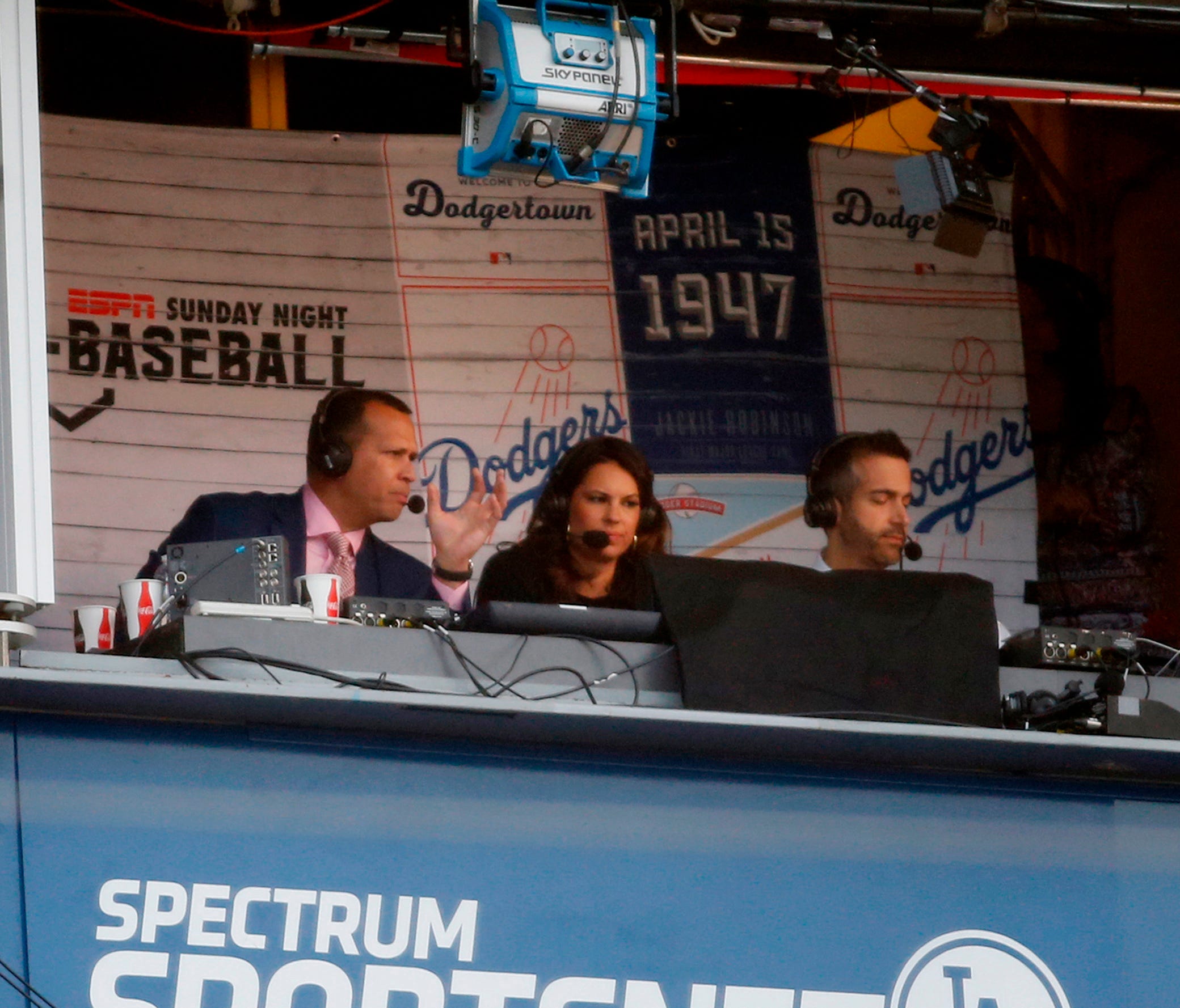 ESPN broadcaster Alex Rodriguez works from the Vin Scully Press Box during the baseball game between the Los Angeles Dodgers and San Francisco Giants.