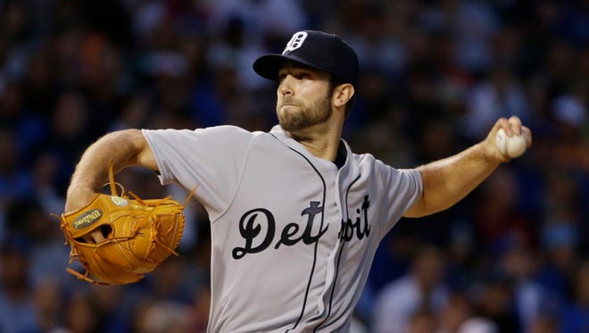 Tigers starter Daniel Norris throws against the Cubs during the first inning Aug. 19, 2015 in Chicago. This throwback jersey honors the 1945 World Series champions.
