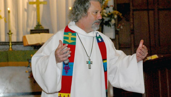 The Rev. Joel Hubbard of Bloomfield's Park United Methodist Church speaks during an interfaith service in July 2016.