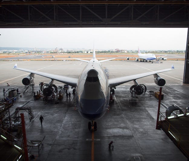 Resting in a giant hangar, a Boeing 747-400 passenger jet undergoes a 'C-check' at the China Airlines maintenance facility outside of Taipei, Taiwan, in early December.