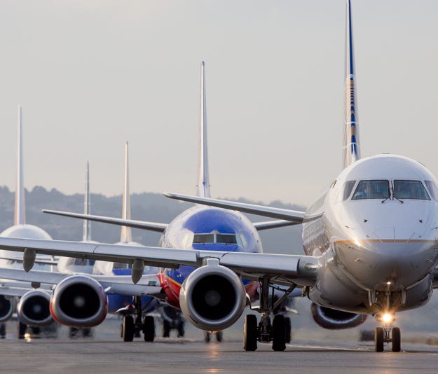 Jets line up for departure during the early evening rush at San Francisco International Airport on Oct. 23, 2016.