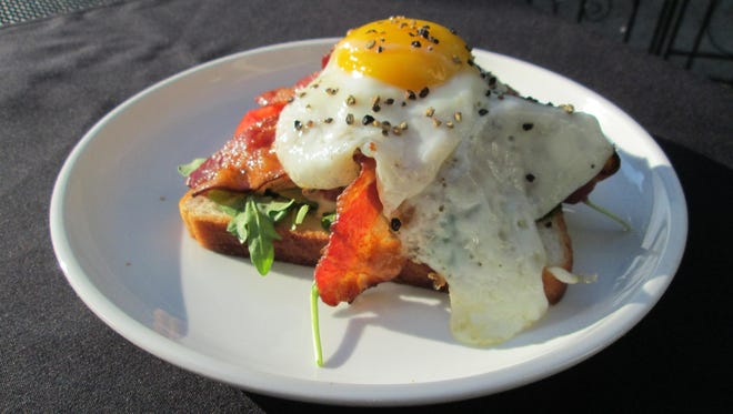 The lobster BLT and E includes lobster salad and a sunny-side up egg on top.