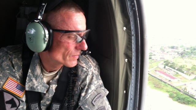 Maj. Gen. Gary Volesky flies over Liberia.