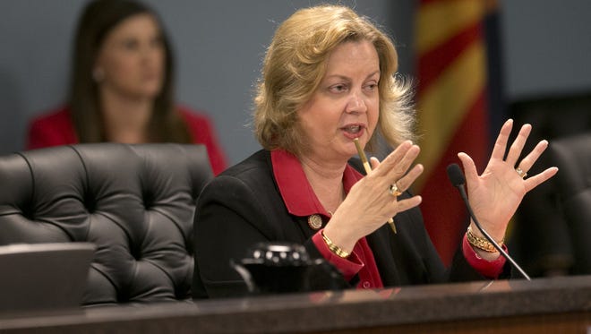 Bitter Smith is chairwoman of the Arizona Corporation Commission, which regulates utilities, water companies and telecommunications, in addition to other duties. She said Thursday she would resign from her position effective Jan. 4.