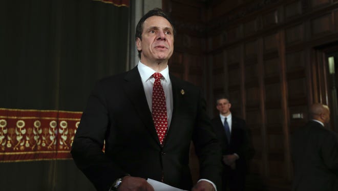New York Gov. Andrew Cuomo leaves a news conference in the Red Room at the Capitol in Albany.