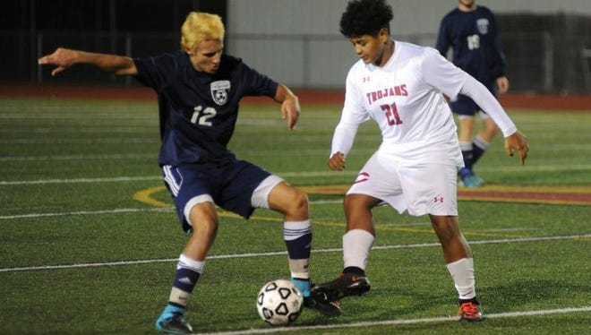 Nick Siml (right) scored a goal for the Trojans in the loss to Gabriel Richard.