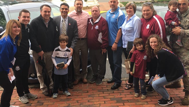 Children, parents and executives for local and statewide soccer associations turned out Thursday afternoon on Public Square in support of the city sports complex land purchase.