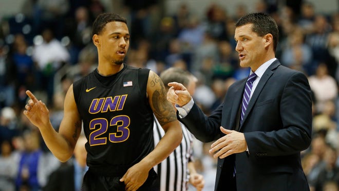 Northern Iowa guard Jordan Ashton (23) gets instructions from head coach Ben Jacobson during the second half of an NCAA college basketball game against Xavier, Saturday, Nov. 26, 2016, in Cincinnati.