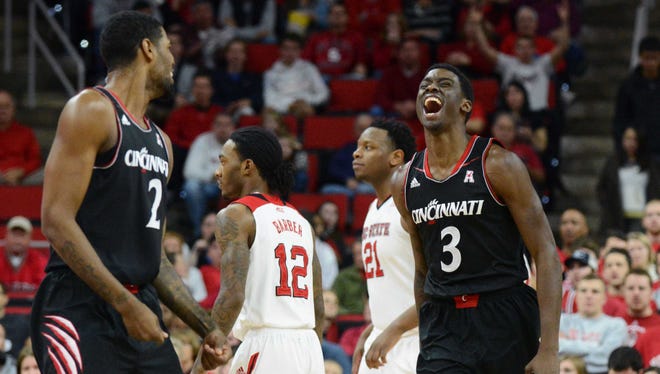 Cincinnati Bearcats forward Shaquille Thomas (3) reacts to scoring during the first half against the North Carolina State Wolfpack at PNC Arena.